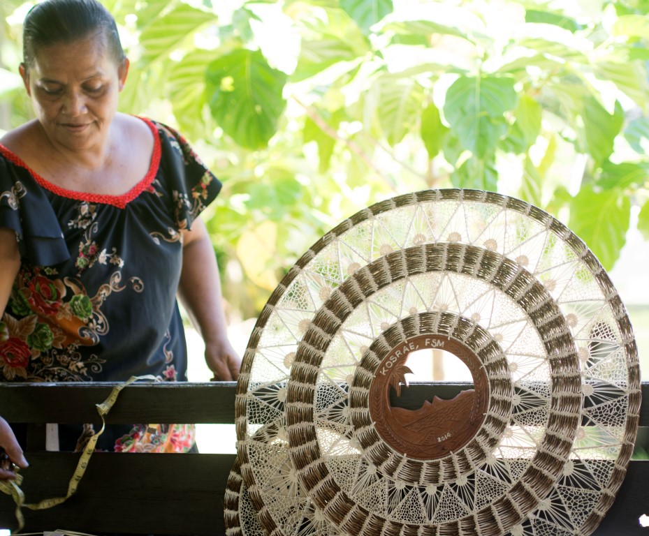 Ines Alokoa, Weaver with a Large Weaving